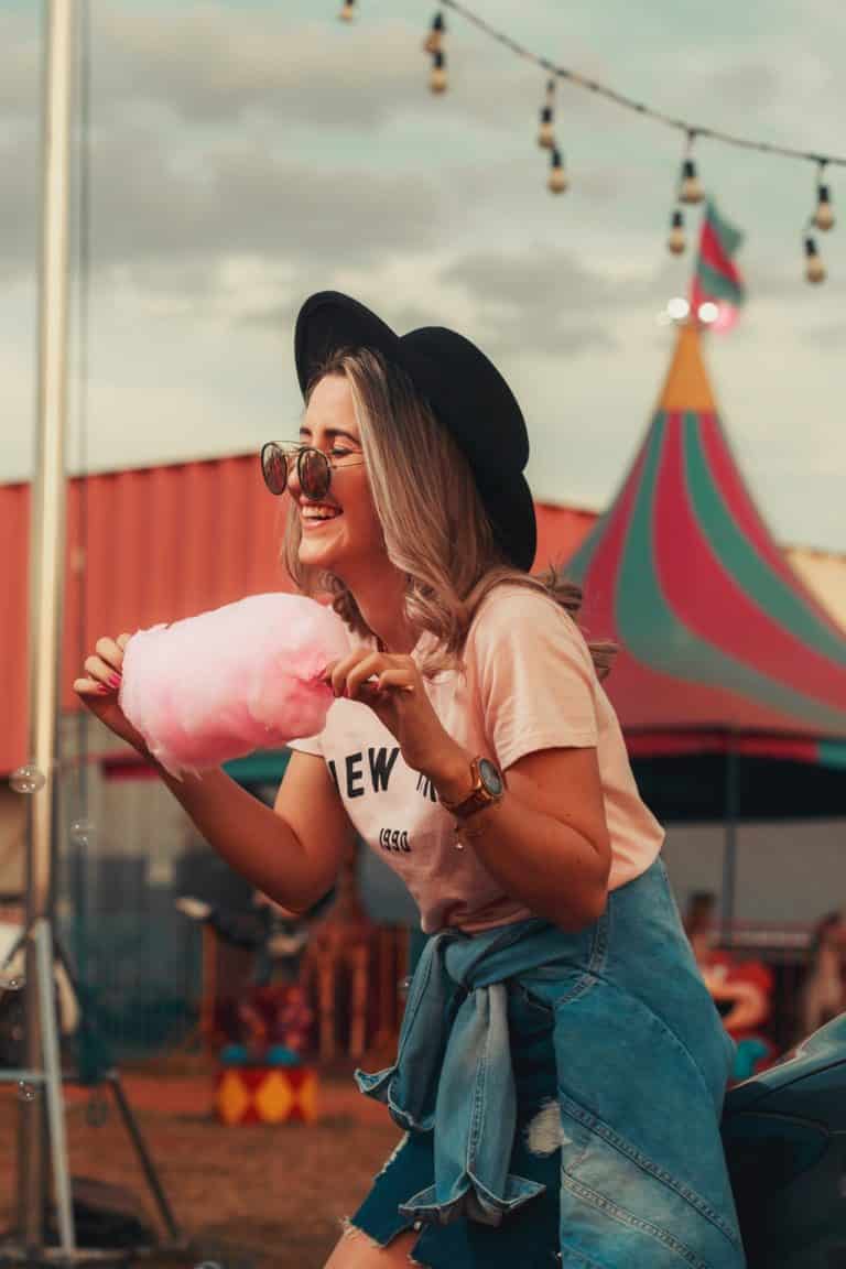 girl eating cotton candy