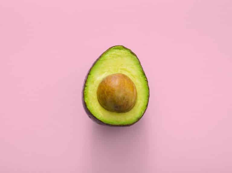 Sliced Avocado Pink Background